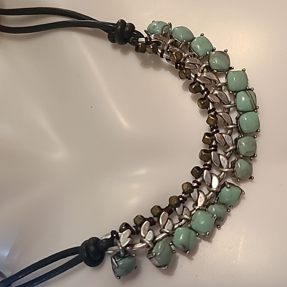 Fossil necklace with green stones and silver color. - Picture 3 of 6
